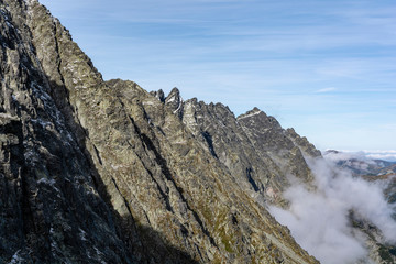 Beautiful view of the mountain peaks in the ridge in the autumn scenery. Tatra Mountains. Slovakia