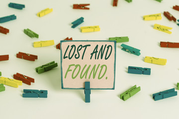 Text sign showing Lost And Found. Business photo text a place where lost items are stored until they reclaimed Colored clothespin papers empty reminder white floor background office