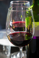 Couple of red wine glasses on table restaurant