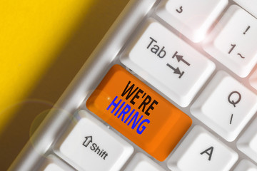 Conceptual hand writing showing We Re Hiring. Concept meaning recently employ someone or pay him to...