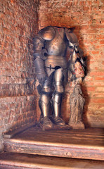 Medieval armor decoration. Headless knight spook in old castle hall.