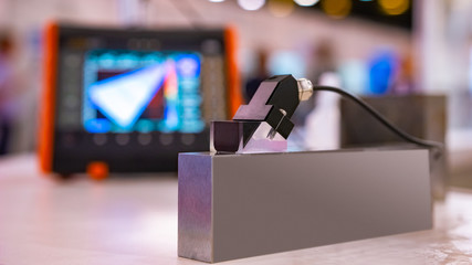 Metalworking equipment. Quality checking. Checking a metal product. Tests of metal structures. Equipment for checking metal. Expertise services for metals and alloys. Industrial equipment. © Grispb