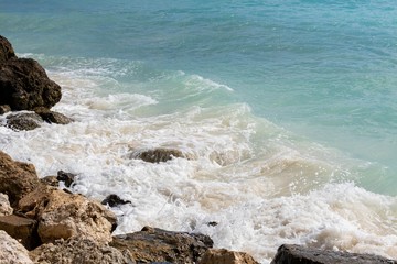 Rocly coast line of Atlantic Ocean. Gorgeous white foamy waves and turquoise water. Beautiful natute landscape backgrounds.