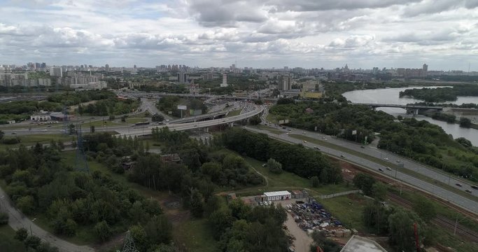 Aerial view on Moscow Automobile Ring Road or MKAD near Volokolamskoye shosse and Mitino, Yuzhnoye Tushino, Pokrovskoye-Streshnevo District of Moscow. Moskva River. Interchange of MKAD and Volokolamsk