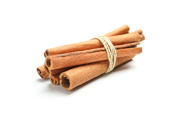 Tied cinnamon sticks isolated on white background. Sweet spice