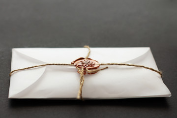 Notary public wax stamper. White envelope with brown wax seal, golden stamp. Responsive design...