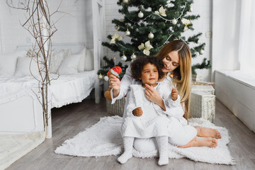 happy multiracial family with gifts at Christmas