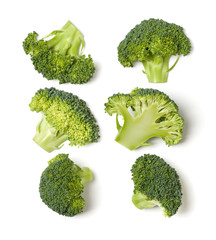 Creative layout made of broccoli. Flat lay, top view. Vegetables isolated over white background. Food ingredient pattern..