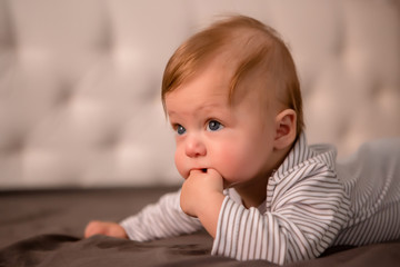 Fototapeta premium baby boy 3 months lying on his stomach at home