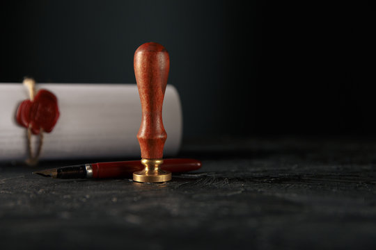 Law, attorney, notary public stamp and pen on desk. law will notary paper lawyer fountain pen seal concept