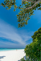 White sand beach, clear water, deep blue sky in the tropical sea of ​​Thailand.