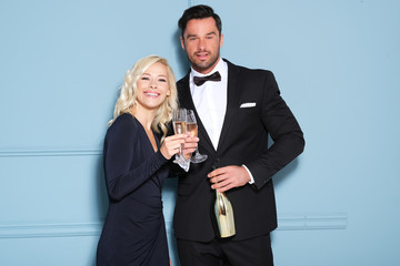 Happy couple making a toast with glass of champagne!