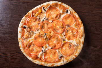 Cheap pizza with mushrooms, tomatoes, and corn.