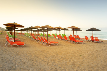 Set of beach chairs and umbrellas in Vrachos