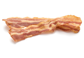 cooked crispy slices of bacon isolated on white background