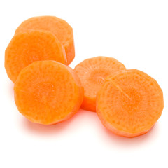 Chopped carrot slices isolated on white background cutout