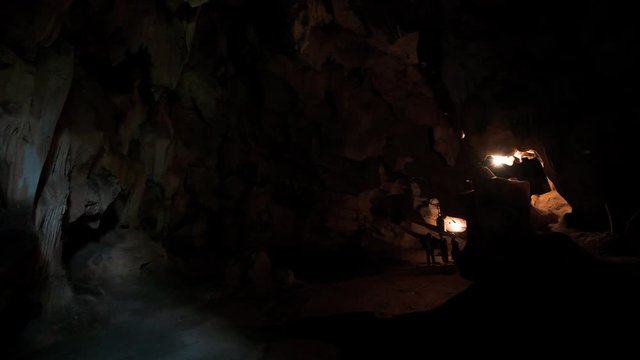Tourists walk through caves at Bich Dong Pagoda, Tam Coc, Vietnam