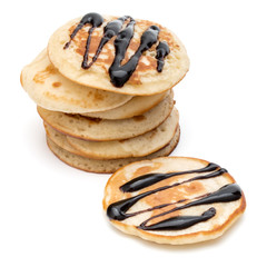 Pancakes  stack with chocolate syrup on white background