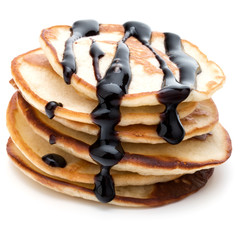 Pancakes  stack with chocolate syrup on white background