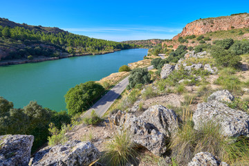 Fototapeta na wymiar Wide angle landscape view of the Laguna La Lengua Lake in the Lagunas de Ruidera Lakes Natural Park, Albacete province, Castilla la Mancha, Spain 