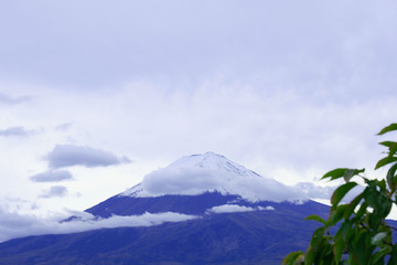Fototapeta na wymiar Mount Fuji covered with snow and white clouds