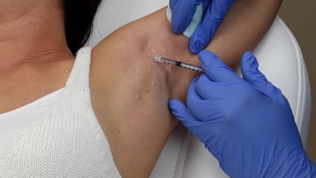 Cinematic view of a dermatology procedure with botox 