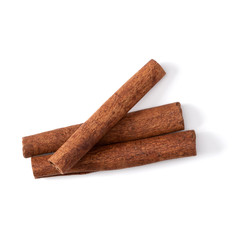 Cinnamon sticks isolated on white background closeup. Canella spice. Aromatic condiment background....