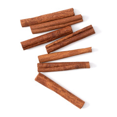Cinnamon sticks isolated on white background closeup. Canella spice. Aromatic condiment background. Flat lay, top view.