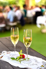 Pair of champagne glasses on a tray to celebrate the love of a couple.