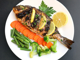 Roasted dorada fish with vegetables