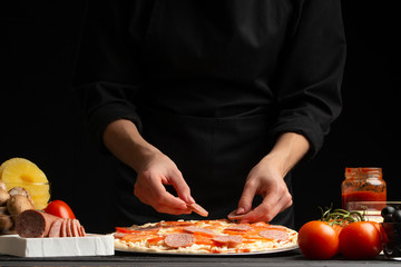 Chef cooks Italian pizza