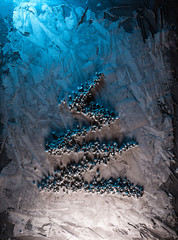 Minimalistic Christmas tree made of decorative pebbles. Christmas card. New Year concept. Flat lay. Top view.