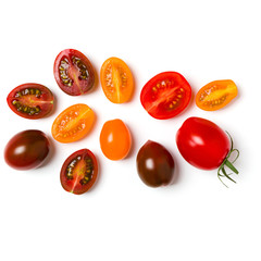 various colorful tomatoes isolated on white background. Top view, flat lay. Creative layout.