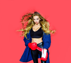 Healthy lifestyle. Fitness slim sporty woman ready for fight. Woman boxer with gloves. Female boxer and fighter concept. Sporty sexy girl in boxing gloves. Young beautiful boxer girl in boxing gloves.