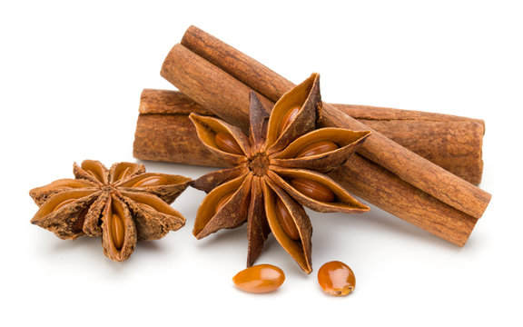 Cinnamon sticks and anise star isolated on white background close up
