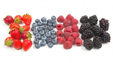 Blackberry, raspberry blueberry and strawberry on a white background. Vitamins and wholesome foods