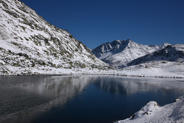 Obraz na płótnie Canvas St. Moritz, Switzerand with lake and snowy mountains