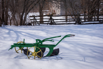 old plow in snow
