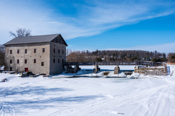Fototapeta na wymiar winter landscape with old mill and snow
