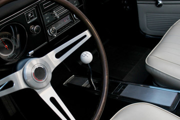 Obraz na płótnie Canvas Beautiful car interior, classic, vintage with manual transmission stick shift