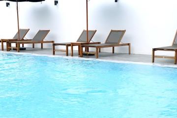 Obraz premium Chair loungers by the pool