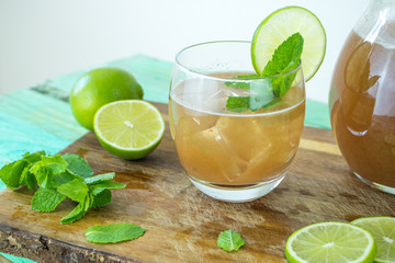 Fototapeta premium Food photography pf a glass of tamarind water with lime and mint