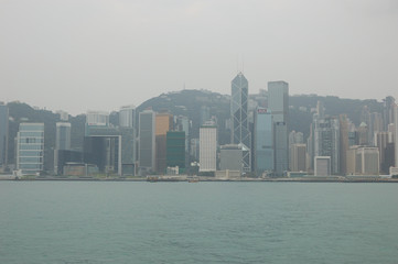 Fototapeta premium The high buildings facing the Victoria Harbour in Hong Kong