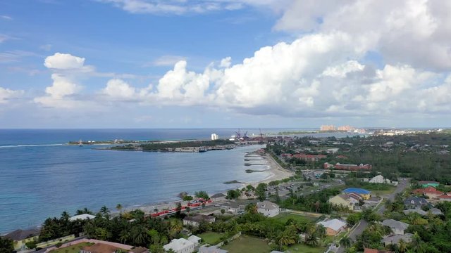 Aerial: City of Nassau, Neighborhood, Traffic, and Tropical Beach