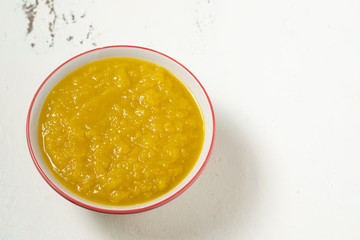 Vegetarian food in autumn season,pumpkin mash for making soup in bowl,copy space