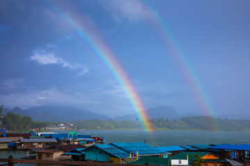 Landscape view of Sangkhlaburi with clouds and rainbow.