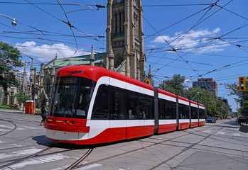 Fototapeta na wymiar Toronto streetcar in front of St. James Cathedral