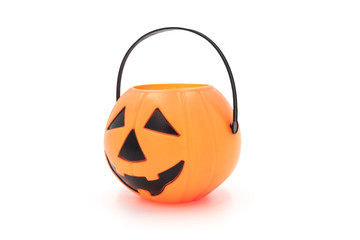Fototapeta premium Halloween props cute plastic pumpkin head basket toy close-up isolated on white background