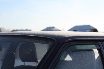 Car interior in winter.  Frozen winter car outdoor.