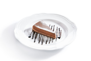Macro Shot of Chocolate Cheesecake on White Plate Isolated